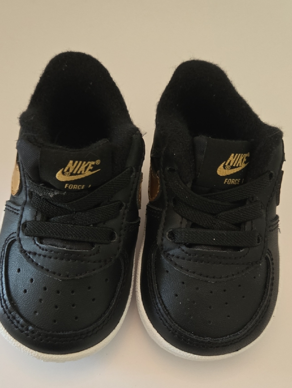 Nike Kids Black and Gold Sneakers